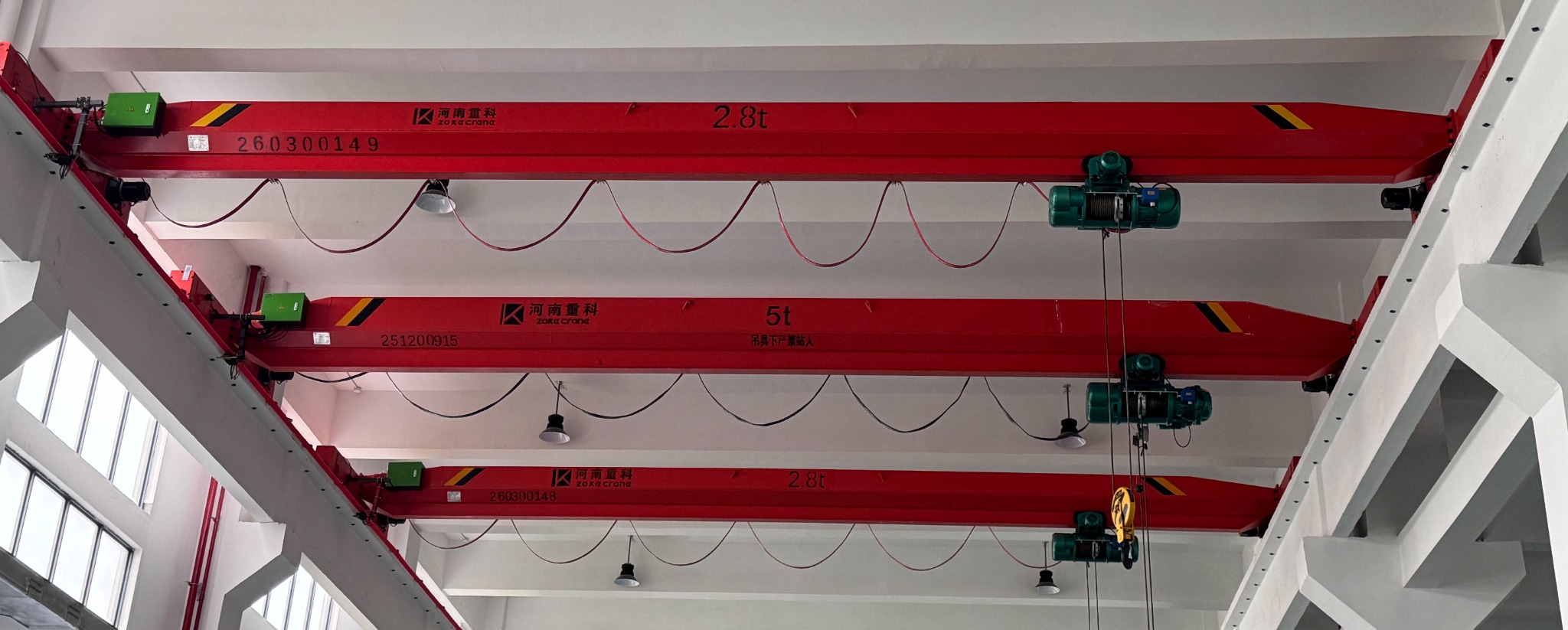 ZOKE electric wire rope hoists installed on three single girder overhead cranes